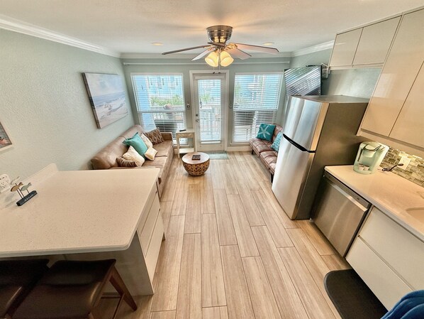 Relax in coastal comfort with stunning Gulf and pool views, a 65” smart TV with cable, Netflix, Disney+, Apple TV+, Peacock Premium, and high-speed Wi-Fi up to 800 Mbps—all in a sleek, open-concept space just steps from the sand.