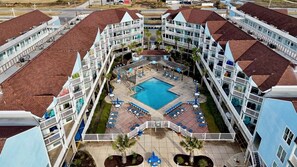 Bird’s-eye view of your beachfront resort—private balconies, heated pools, and seamless beach access on Galveston’s peaceful West End.