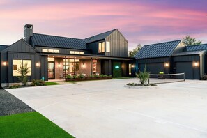 Two sports courts are available just outside of the main home. Enjoy a basketball and separate pickleball court!