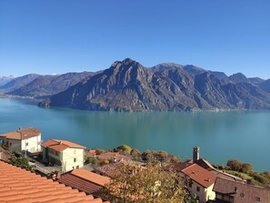Water, Sky, Mountain, Building, Azure, Natural Landscape, Lake, House, Highland, Coastal And Oceanic Landforms