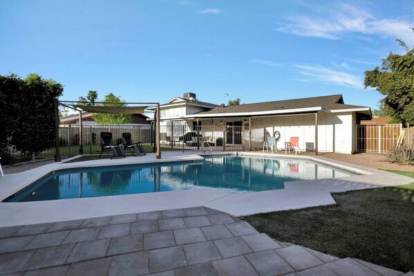 Inviting pool perfect for cooling off on hot days, complete with a lounger for ultimate relaxation.
