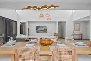 Stunning dining table, where style meets comfort for memorable meals - Beautiful woven chairs, warm wood tones & unique lighting set the perfect atmosphere - Whether it’s a casual breakfast or a special dinner, this space brings everyone together