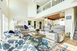 Open main level space with beachy décor throughout