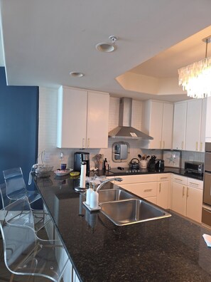 Open Kitchen with 4 bar stools
