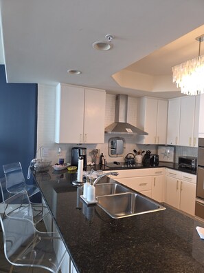 Open Kitchen with 4 bar stools