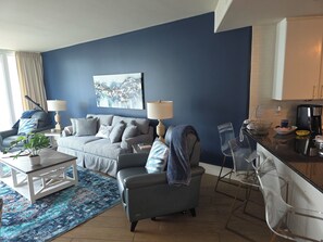 Cozy Oceanside living room with pull out queen bed and power recliners