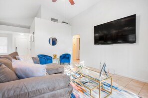 Spacious living room to enjoy the company of loved ones and arcade gaming.