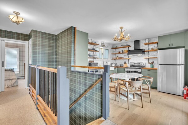 Kitchen and hall to upper floor bedroom