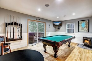 Game room with pool table, balcony access to hot tub