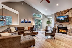 Spacious living space with flat screen TV, fireplace