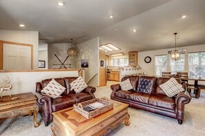 Living room with Smart TV, gas fireplace (works intermittently), and comfortable seating