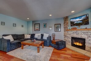 Living room is equipped with SmartTV and a fireplace
