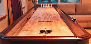 Challenge friends to a shuffleboard match in the game room #GameOn