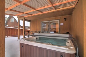 Take a dip in the private hot tub in the backyard