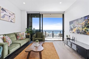 The elegant living area overlooking the ocean and the city