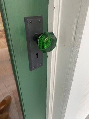 Emerald green glass front door knob.
