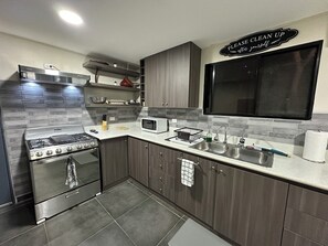 Fully stocked Kitchen oven, fridge, pan, utensils, microwave, coffee pot & more 