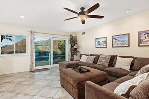 The fireplace is NOT for use, smart TV with Roku, large sofa, back patio access