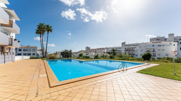 Take a refreshing dip in the shared pool, surrounded by serene greenery and blue skies #refreshing #serene #portugal #pt #albufeira