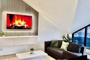 Cosy living room with smart tv and terrace 
