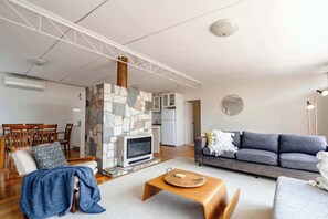 Sink into the comfy lounge set by the crazy stone hearth, housing an electric heater, creating the perfect ambience for cooler evenings