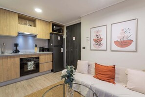 Experience a cozy retreat with a modern kitchen and inviting living space, perfect for your next getaway!