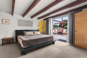 Primary bedroom suite with direct access to the outdoor deck
