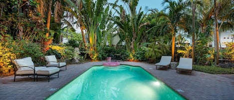 Unwind in paradise as the sun sets over your private pool oasis—surrounded by lush, illuminated landscaping and tranquil tropical vibes. A picture-perfect end to any vacation day.