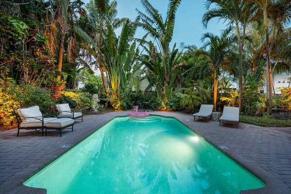 Unwind in paradise as the sun sets over your private pool oasis—surrounded by lush, illuminated landscaping and tranquil tropical vibes. A picture-perfect end to any vacation day.