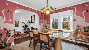 Dine in style. This Gucci-wallpapered dining room brings a touch of opulence to every meal, complete with elegant tableware for 6