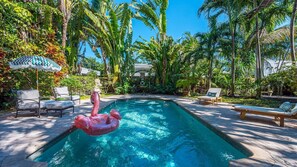Your private outdoor paradise awaits! Lounge by the large heated pool, surrounded by lush tropical landscaping, or enjoy alfresco dining on the covered patio. With a gas grill, bistro set, and sun loungers, relaxation is guaranteed.