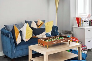 The kids will LOVE having their very own space to play and enjoy board games, mini table foosball, books, coloring books, toys & more! Also, this is a great option for the kids to watch Netflix while you enjoy your shows downstairs!