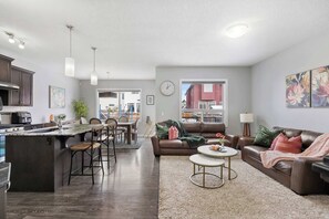 Large open-concept space for entertaining your family and guests! The Living room, dining area, and kitchen have plenty of comfortable seating options to relax and enjoy your stay! 