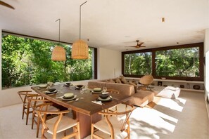 Comfortable dining area for 8 guests. Windows create a unique connection to the outdoors.
