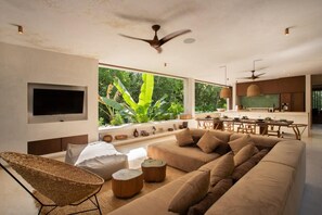 Elegant ground floor with an open concept living-dining area. Furniture and decorations in natural and rustic tones.