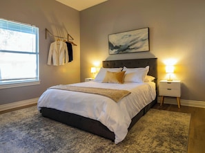 Recharge in the private bedroom, featuring a plush queen bed