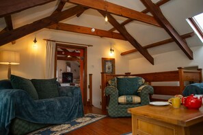 Lounge with door leading to kitchen/dining area