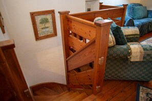 Wooden stairs leading to the ground floor bedrooms