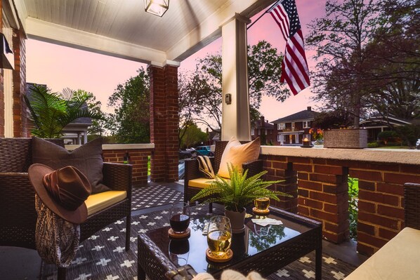A delightful front porch with inviting seating, perfect for unwinding and enjoying the fresh air.