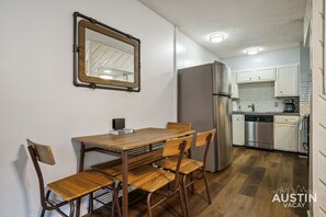 Pull up a chair, grab a bite, and enjoy kitchen views with a touch of rustic charm!