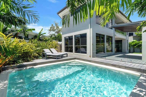 Bask by the sparkling private pool, where sun loungers and tropical breezes create the perfect setting for relaxation.