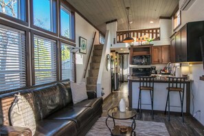 Relax and unwind in this open and airy tiny home living area.