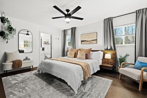 The king bedroom offers a spacious and comfortable retreat, with a plush bed ensuring a restful night’s sleep.