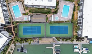 2 heated pools, 2 hot tubs, 2 tennis courts & a restaurant anchor the complex!