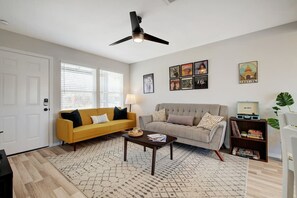 Living room with vintage record player, vinyl records, and games