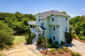 Beautiful elevated beach house with multiple decks—Best Duck in a Row offers space, privacy, and laid-back coastal charm.