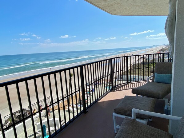 Relax and enjoy this large oceanfront balcony with lots of comfortable seating.