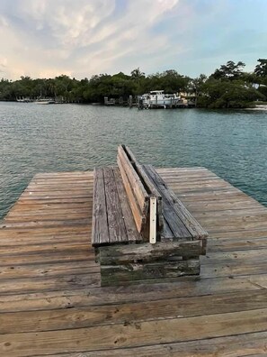 One house off public fishing dock and boat ramp.