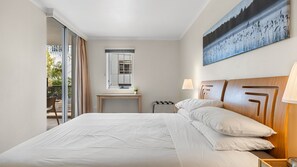 Bright & Airy Space – Large windows and a balcony door let in plenty of natural light for a refreshing stay.