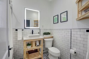 Fresh and functional, the full bathroom offers a tub/shower combo and all the essentials for a refreshing start to your day.